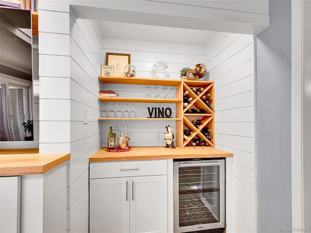 3481 S Race St, Englewood, CO 80113 - indoor dry bar with wine cooler, wooden walls, and ornamental molding