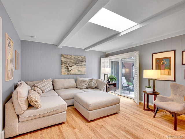 3481 S Race St, Englewood, CO 80113 - living room featuring light wood-style flooring and beam ceiling