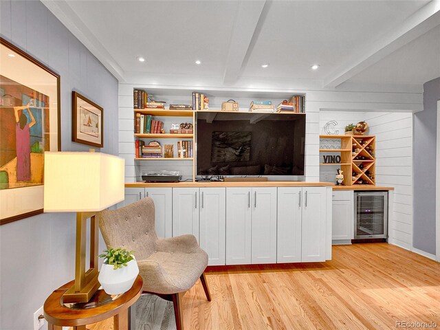 3481 S Race St, Englewood, CO 80113 - living area with wine cooler, a dry bar, light wood finished floors, beam ceiling, and built in features