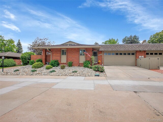3481 S Race St, Englewood, CO 80113 - single story home featuring brick siding, a garage, and concrete driveway