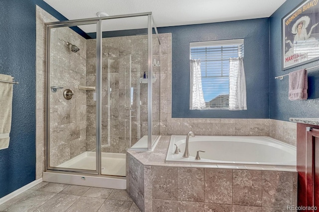 bathroom featuring vanity and separate shower and tub