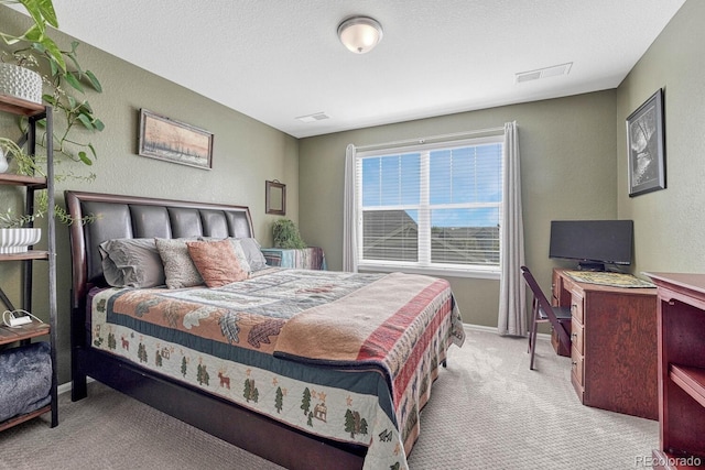 carpeted bedroom with a textured ceiling