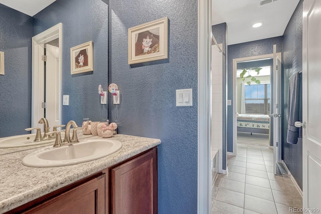 bathroom with tile patterned floors and vanity