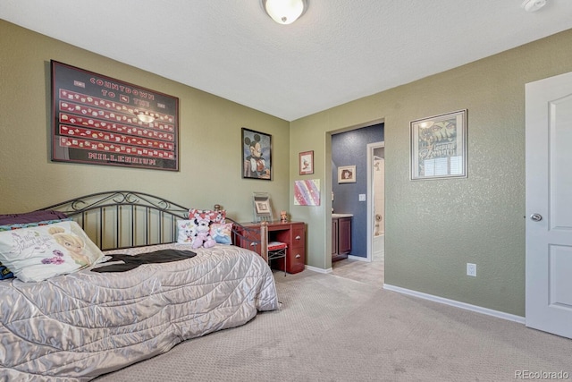 carpeted bedroom featuring a textured ceiling