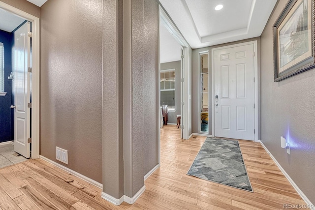 foyer entrance with light hardwood / wood-style flooring