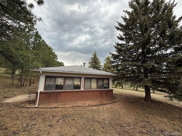 1013 Lexington Ln, Estes Park, CO 80517 - rear view of property featuring brick siding