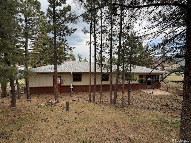 1013 Lexington Ln, Estes Park, CO 80517 - rear view of house with board and batten siding and roof with shingles