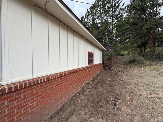 1013 Lexington Ln, Estes Park, CO 80517 - view of side of home with brick siding and board and batten siding