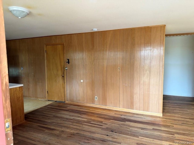 1013 Lexington Ln, Estes Park, CO 80517 - empty room with wood finished floors, wooden walls, and a smoke detector
