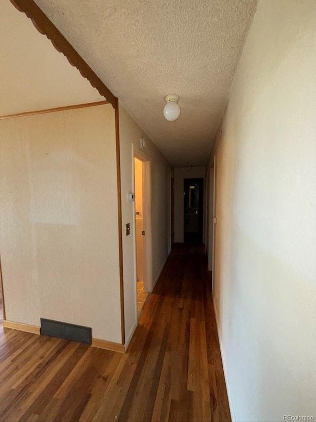 1013 Lexington Ln, Estes Park, CO 80517 - corridor featuring a textured ceiling and wood finished floors