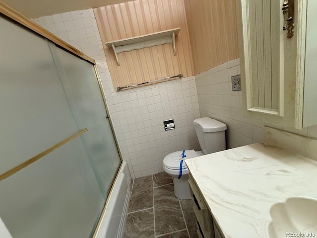 1013 Lexington Ln, Estes Park, CO 80517 - bathroom featuring vanity, enclosed tub / shower combo, and tile walls