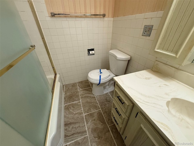 1013 Lexington Ln, Estes Park, CO 80517 - bathroom featuring vanity, tile walls, and enclosed tub / shower combo