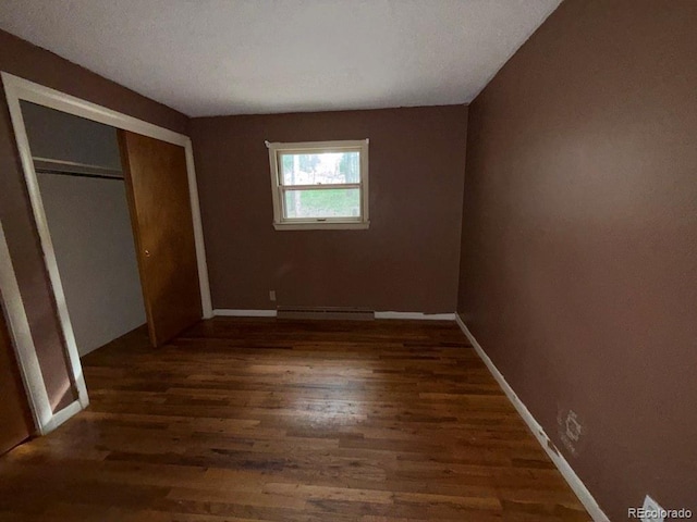 1013 Lexington Ln, Estes Park, CO 80517 - unfurnished bedroom featuring wood finished floors and a closet
