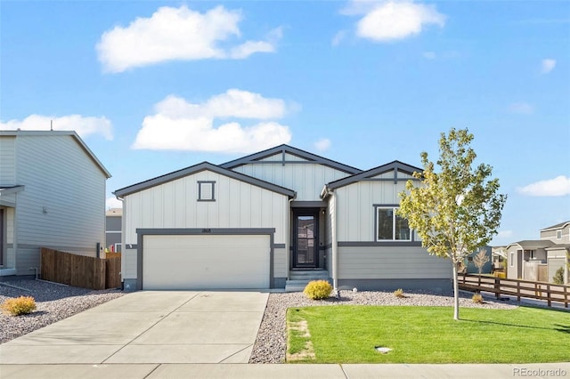 1868 Homestead Dr, Fort Lupton, CO 80621 - view of front of property featuring board and batten siding, a garage, and concrete driveway