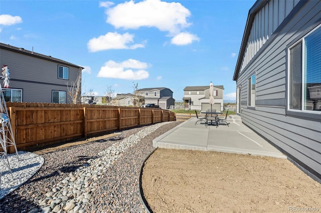 1868 Homestead Dr, Fort Lupton, CO 80621 - view of yard with a residential view, a patio area, and fence
