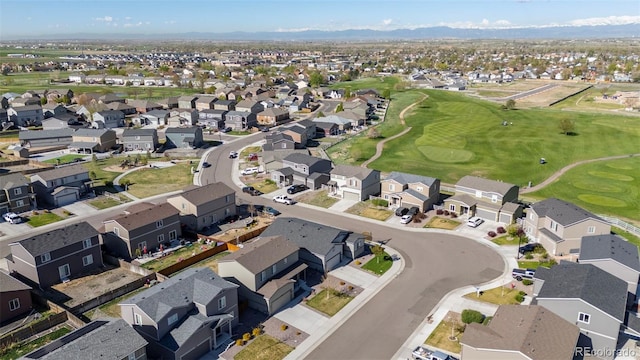 1868 Homestead Dr, Fort Lupton, CO 80621 - aerial view of property's location with nearby suburban area, a mountain backdrop, and a local golf course