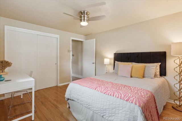 bedroom with light wood finished floors, baseboards, a closet, and ceiling fan