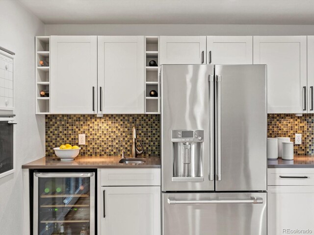 7055 E Heritage Pl S, Centennial, CO 80111 - kitchen with stainless steel refrigerator with ice dispenser, open shelves, beverage cooler, and white cabinets