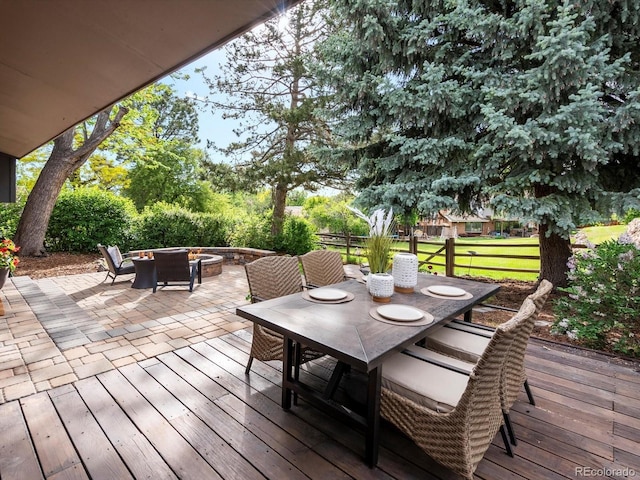7055 E Heritage Pl S, Centennial, CO 80111 - wooden deck featuring a fire pit, outdoor dining area, and a patio