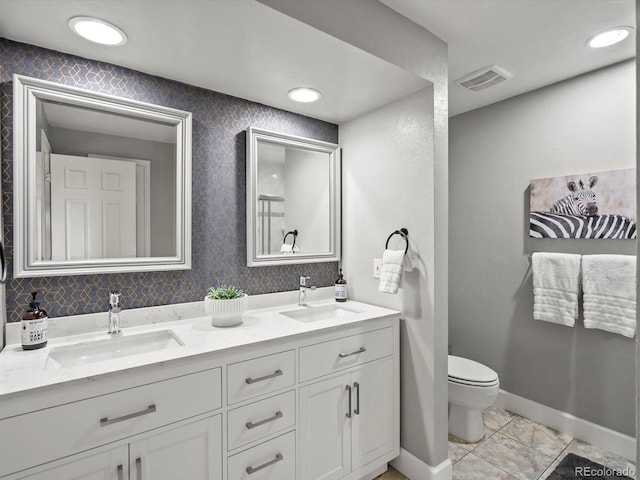 7055 E Heritage Pl S, Centennial, CO 80111 - full bathroom with double vanity, toilet, and baseboards