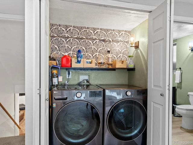 7055 E Heritage Pl S, Centennial, CO 80111 - laundry area featuring washer and clothes dryer and wood finished floors