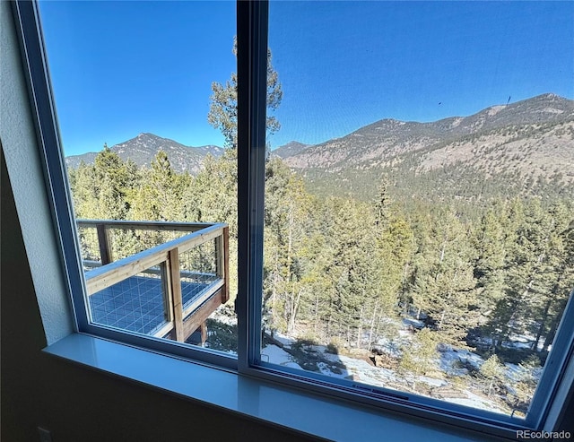 property view of mountains featuring a forest view