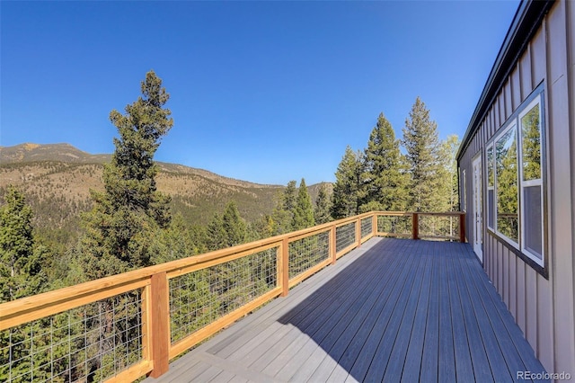 wooden deck with a mountain view