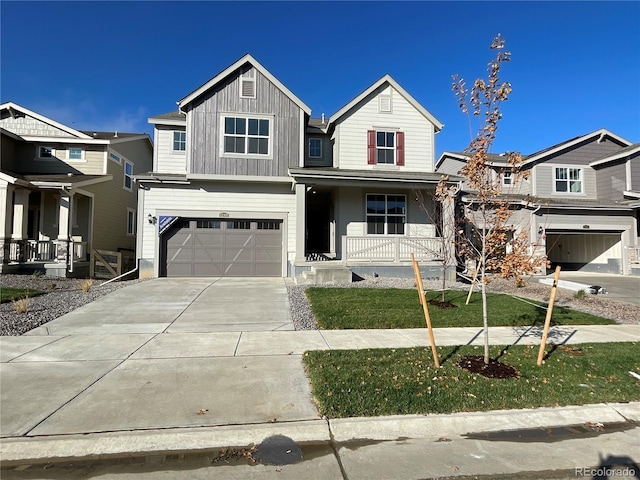 view of front of property with covered porch and a garage