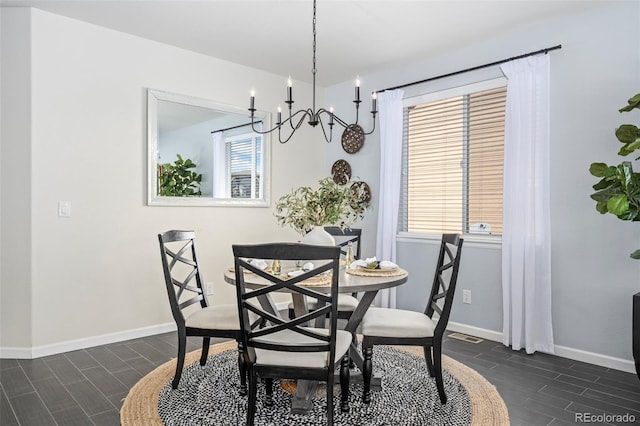 dining area with wood tiled floor and baseboards