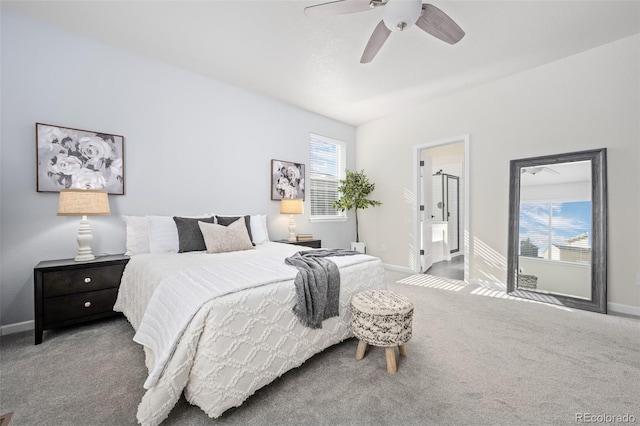 carpeted bedroom with multiple windows, a ceiling fan, and baseboards