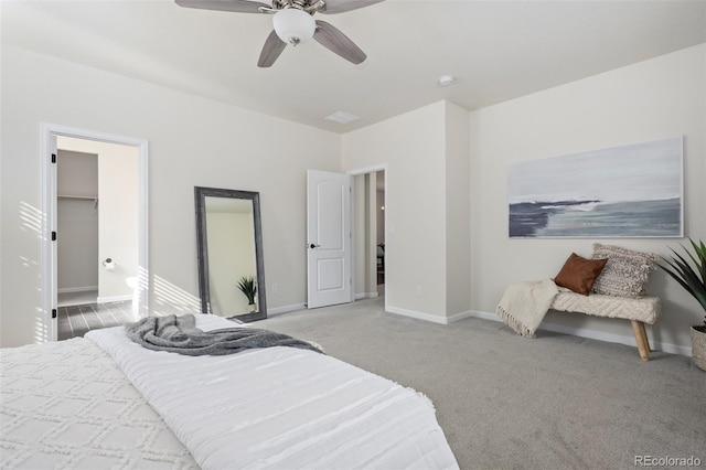 carpeted bedroom with ceiling fan and baseboards