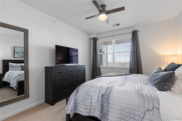 bedroom featuring ceiling fan, light colored carpet, baseboards, and visible vents