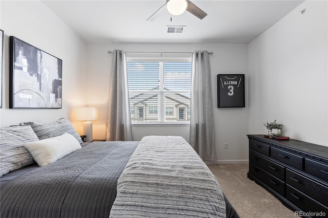 bedroom featuring baseboards, carpet flooring, ceiling fan, and visible vents