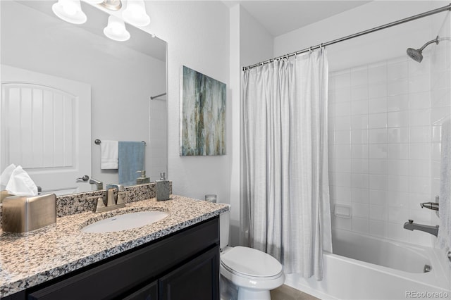 full bathroom featuring toilet, vanity, and shower / tub combo with curtain