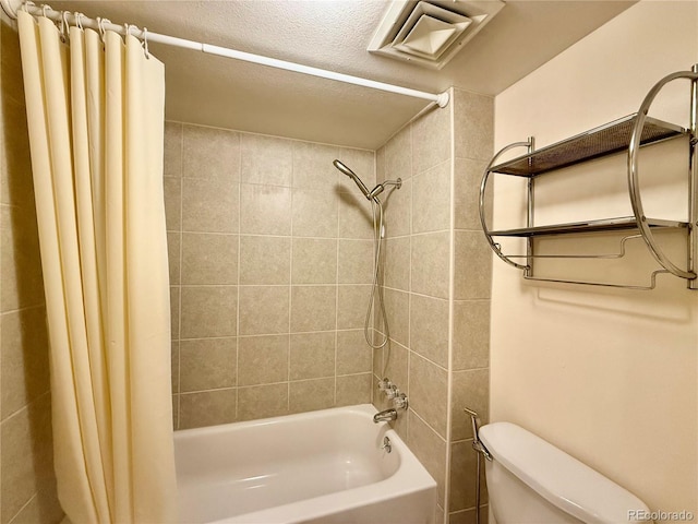 bathroom with toilet and shower / bath combo