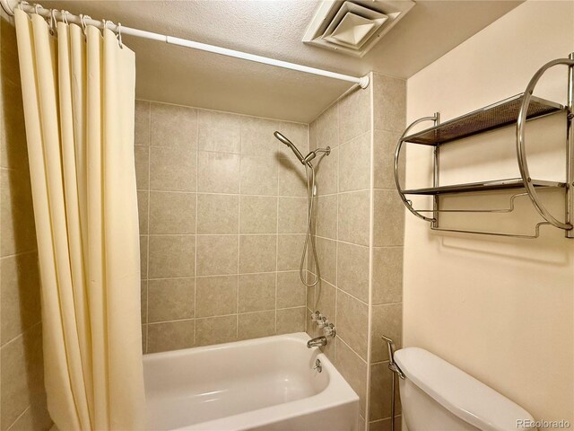 3414 S Locust St Unit D, Denver, CO 80222 - bathroom with shower / bathtub combination with curtain and a textured ceiling