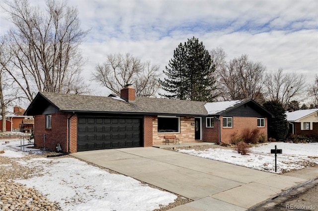 ranch-style house featuring a garage