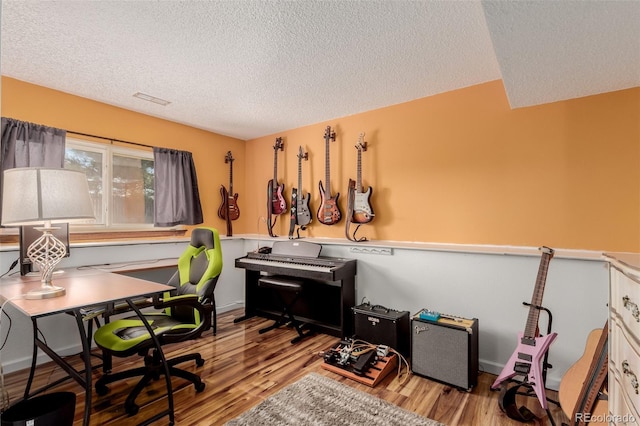 office space featuring a textured ceiling and wood finished floors