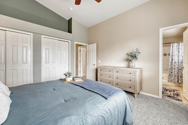 bedroom featuring multiple closets, ceiling fan, high vaulted ceiling, ensuite bathroom, and carpet