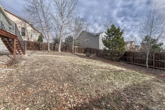 view of yard with a wooden deck