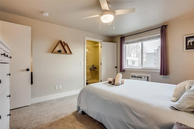 bedroom featuring ceiling fan, baseboards, carpet flooring, and a wall mounted air conditioner