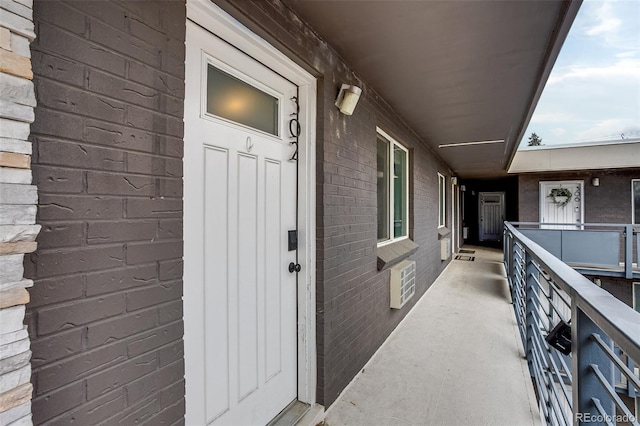 property entrance with brick siding