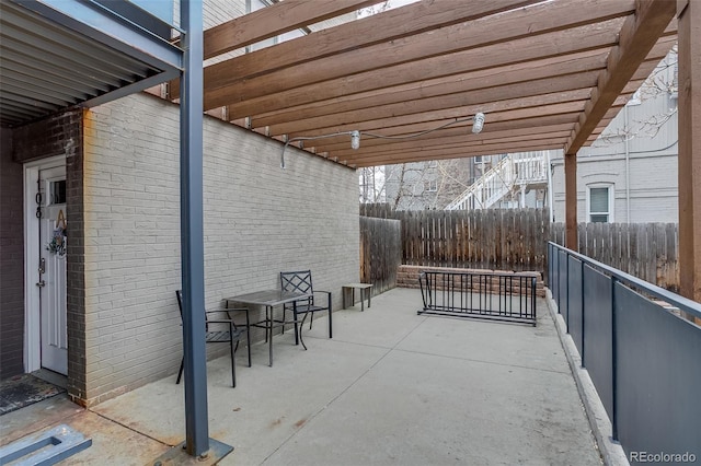 view of patio / terrace featuring fence