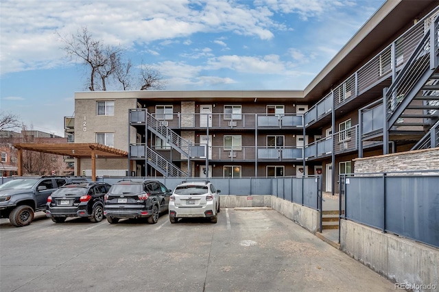 view of property featuring uncovered parking