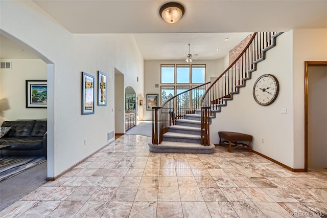 foyer featuring ceiling fan