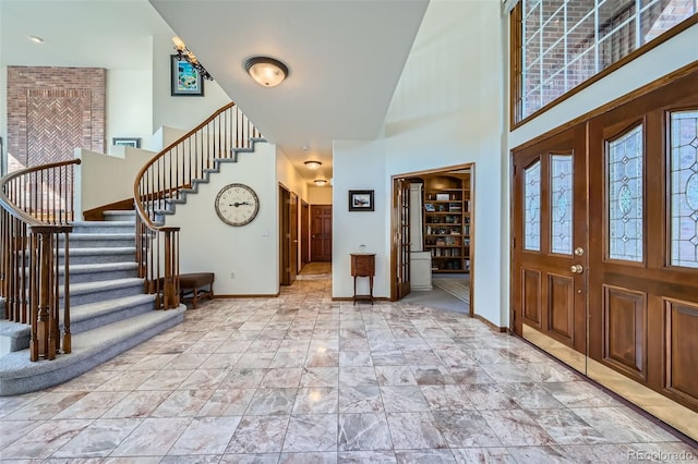 foyer with a towering ceiling