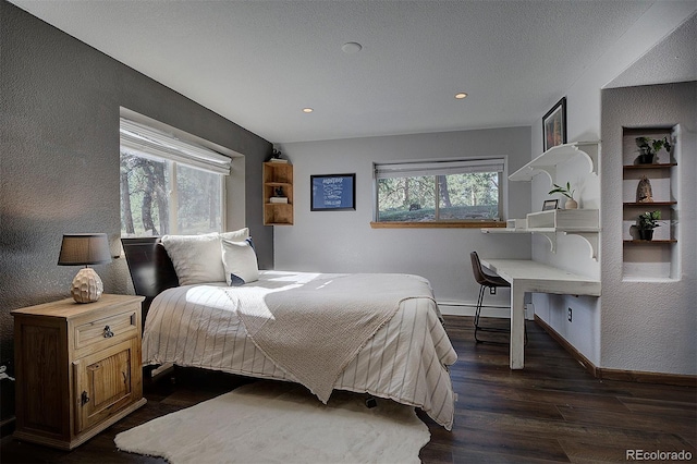 28051 Camel Heights Cir, Evergreen, CO 80439 - bedroom featuring dark wood-type flooring, a baseboard radiator, recessed lighting, and a textured wall