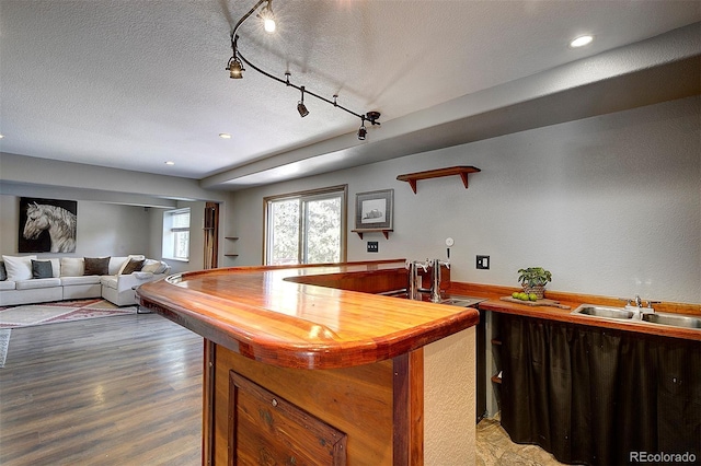28051 Camel Heights Cir, Evergreen, CO 80439 - kitchen with a textured ceiling, wood finished floors, recessed lighting, and wood counters