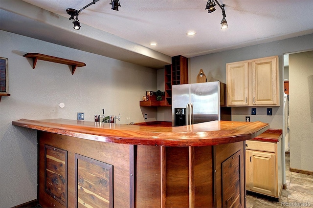 28051 Camel Heights Cir, Evergreen, CO 80439 - indoor wet bar featuring stainless steel refrigerator with ice dispenser, track lighting, and recessed lighting