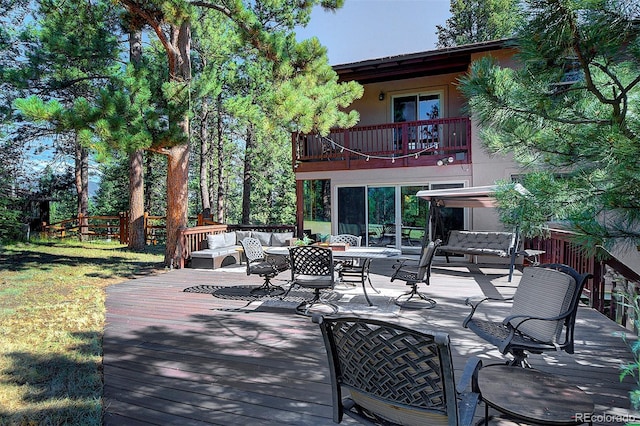 28051 Camel Heights Cir, Evergreen, CO 80439 - wooden terrace with outdoor lounge area